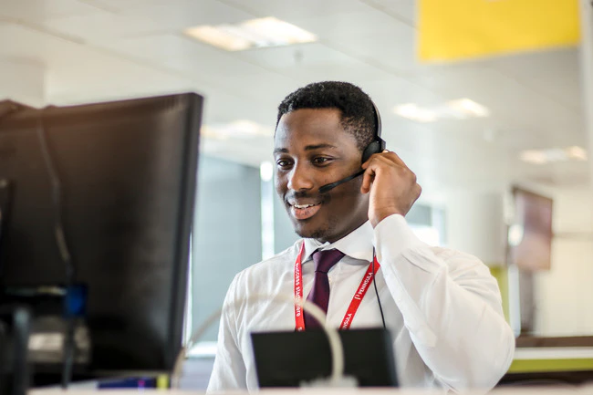 HR Management Software - An advisor talking on the phone.