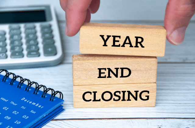year end closing written on jenga blocks