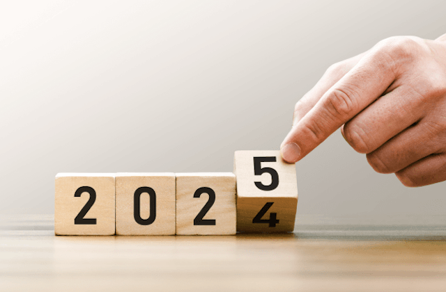 person putting down blocks to say 2025