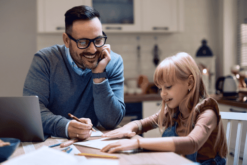 Father helping daughter with homework