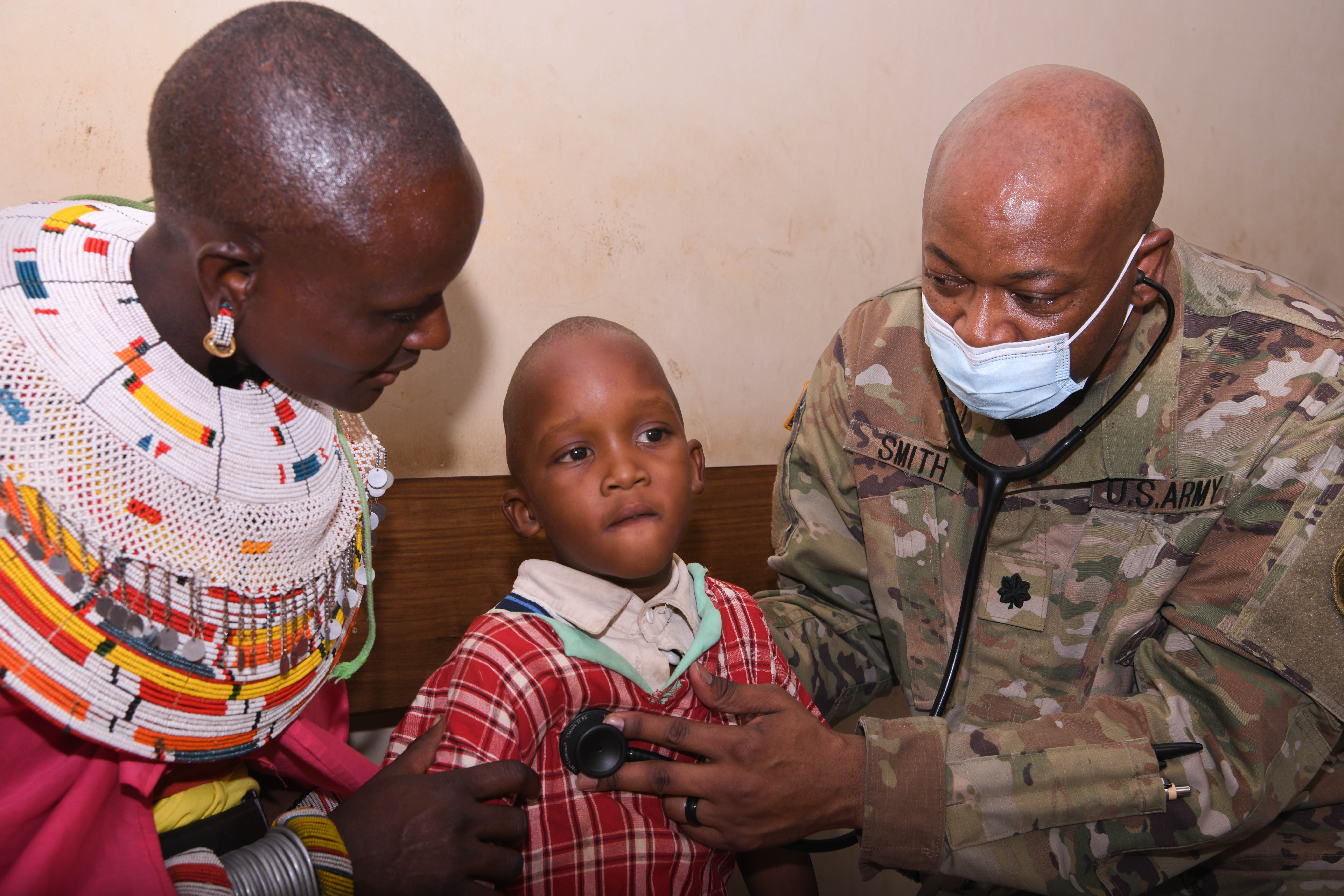 Kenyan Family Awaits Medical Care During a Medical Civic Action Program as Part of Exercise Justified Accord 2025. 
