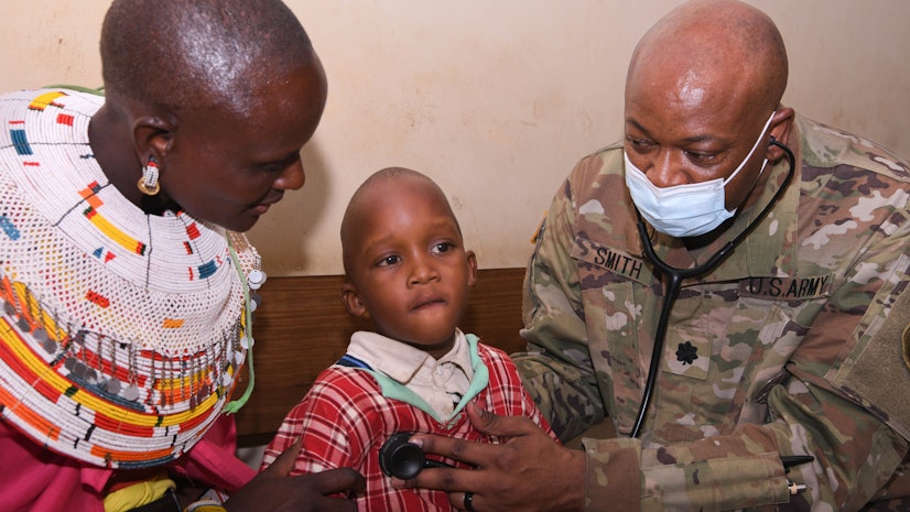 Kenyan Family Awaits Medical Care During a Medical Civic Action Program as Part of Exercise Justified Accord 2025.