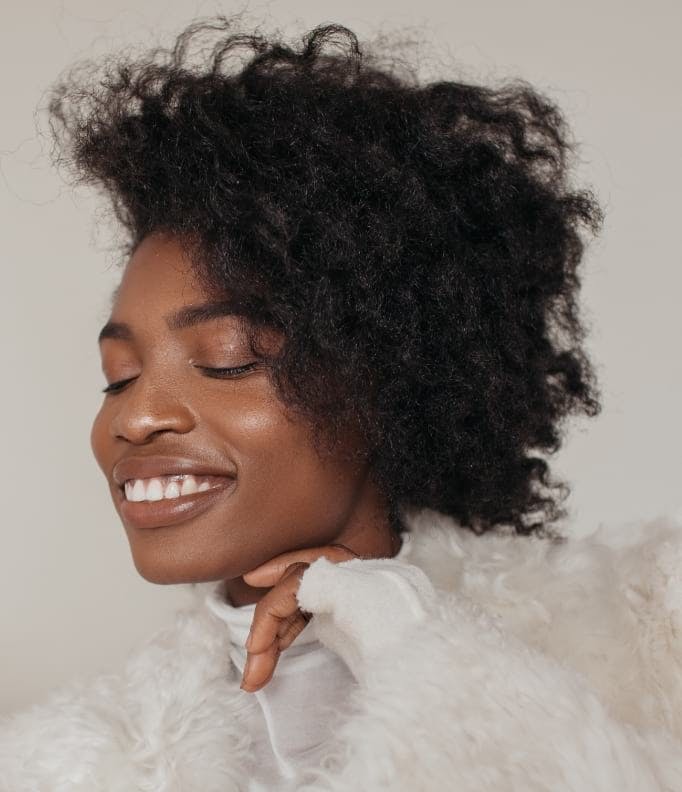 Woman with curly hair smiling