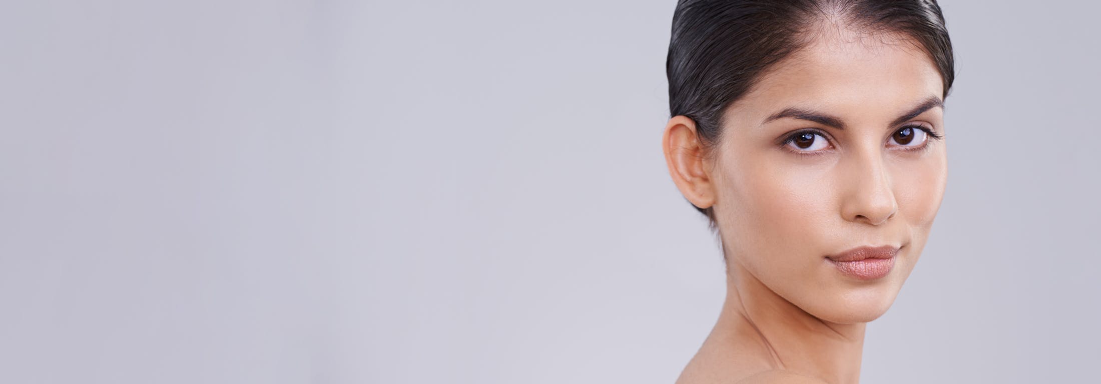 brunette woman with hair back