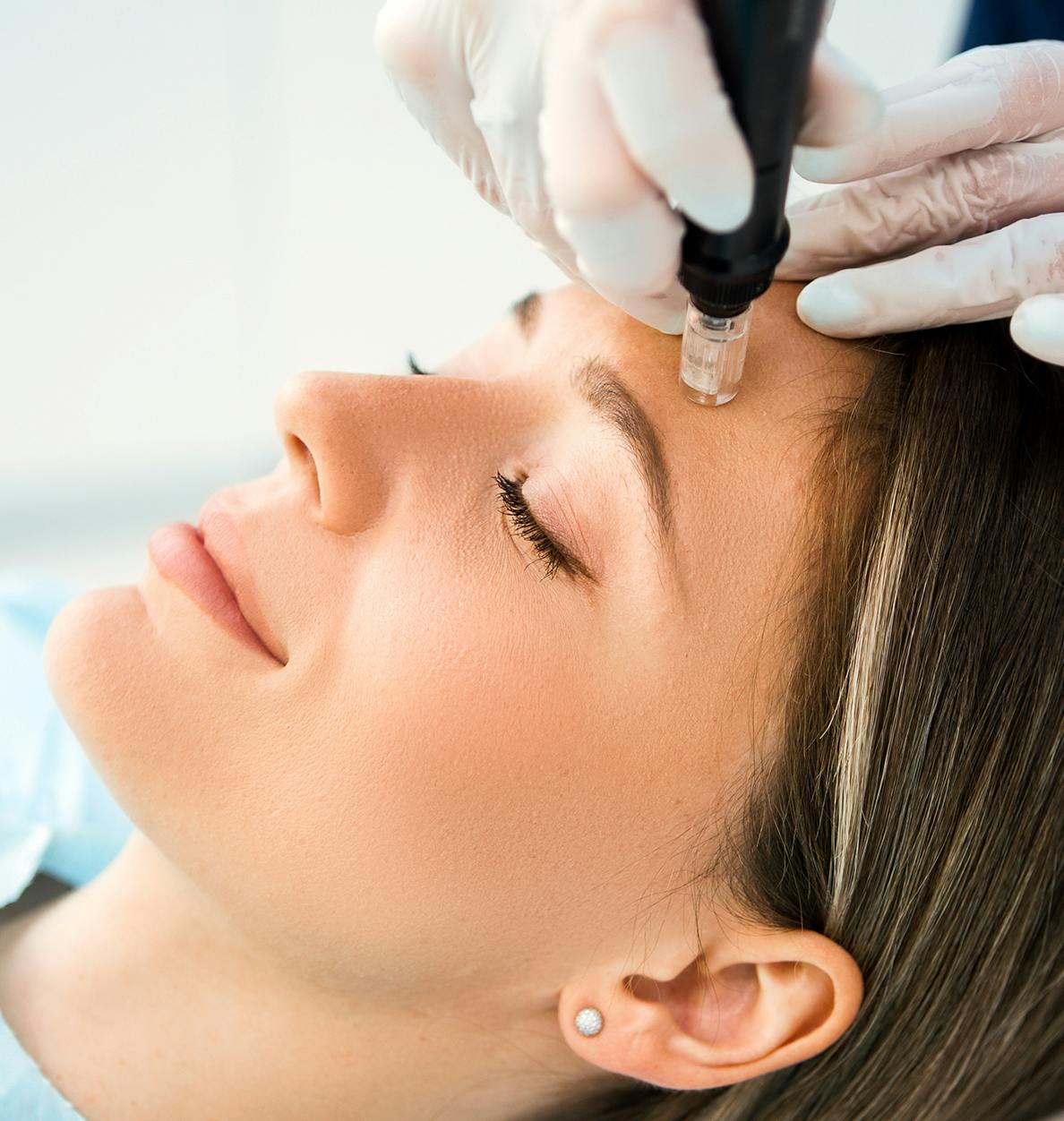 Woman recieving a facial rejuvenation treatment at Beck Aesthetic Surgery