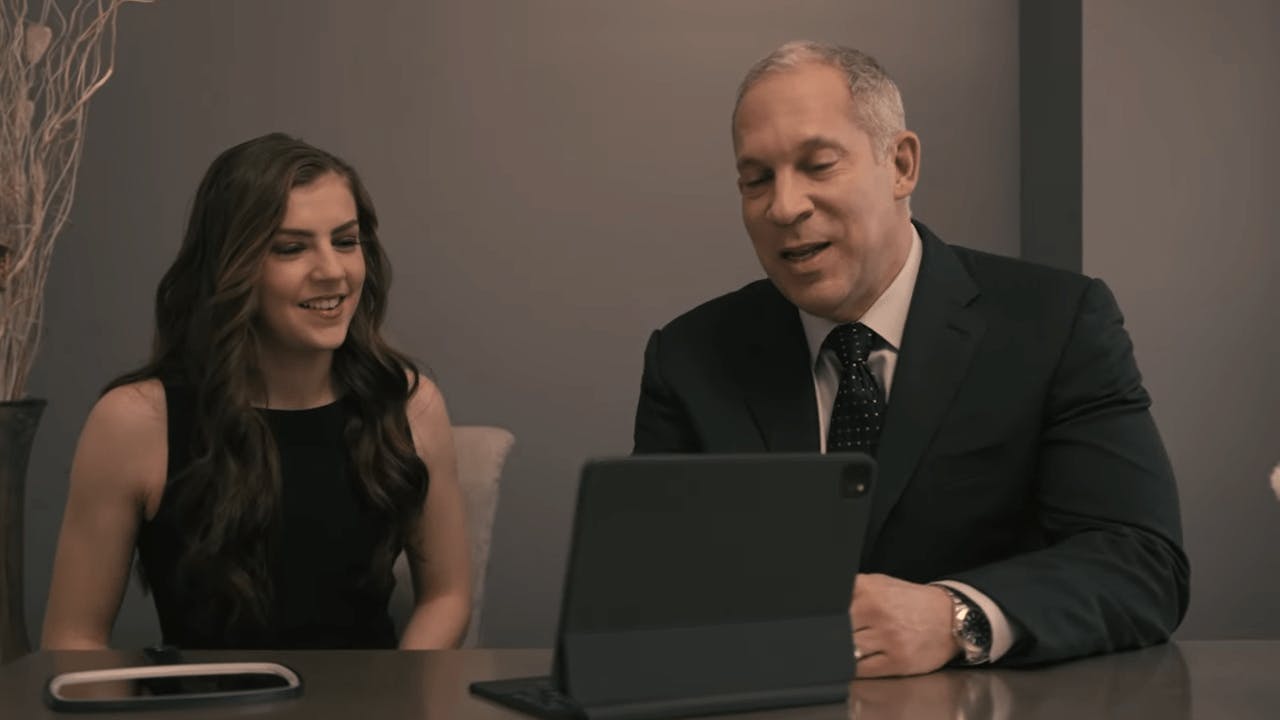 Charlote Plastic Surgeon, Dr. Beck showing an ipad to a patient