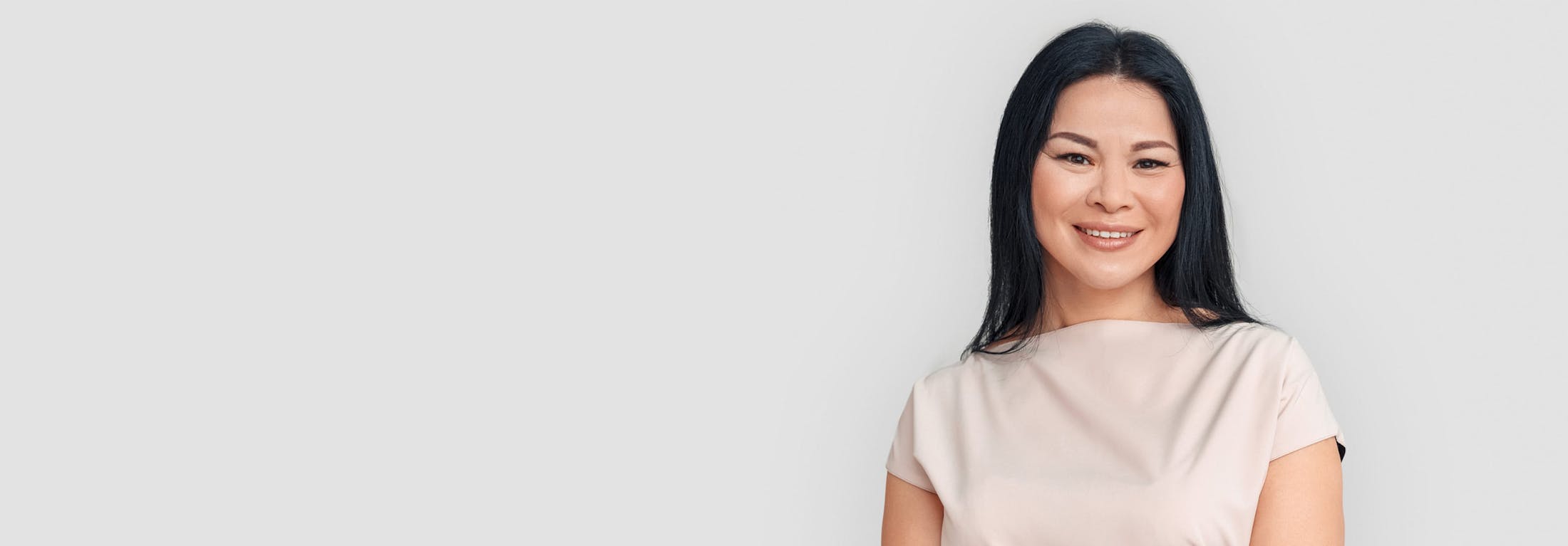 woman with black hair smiling