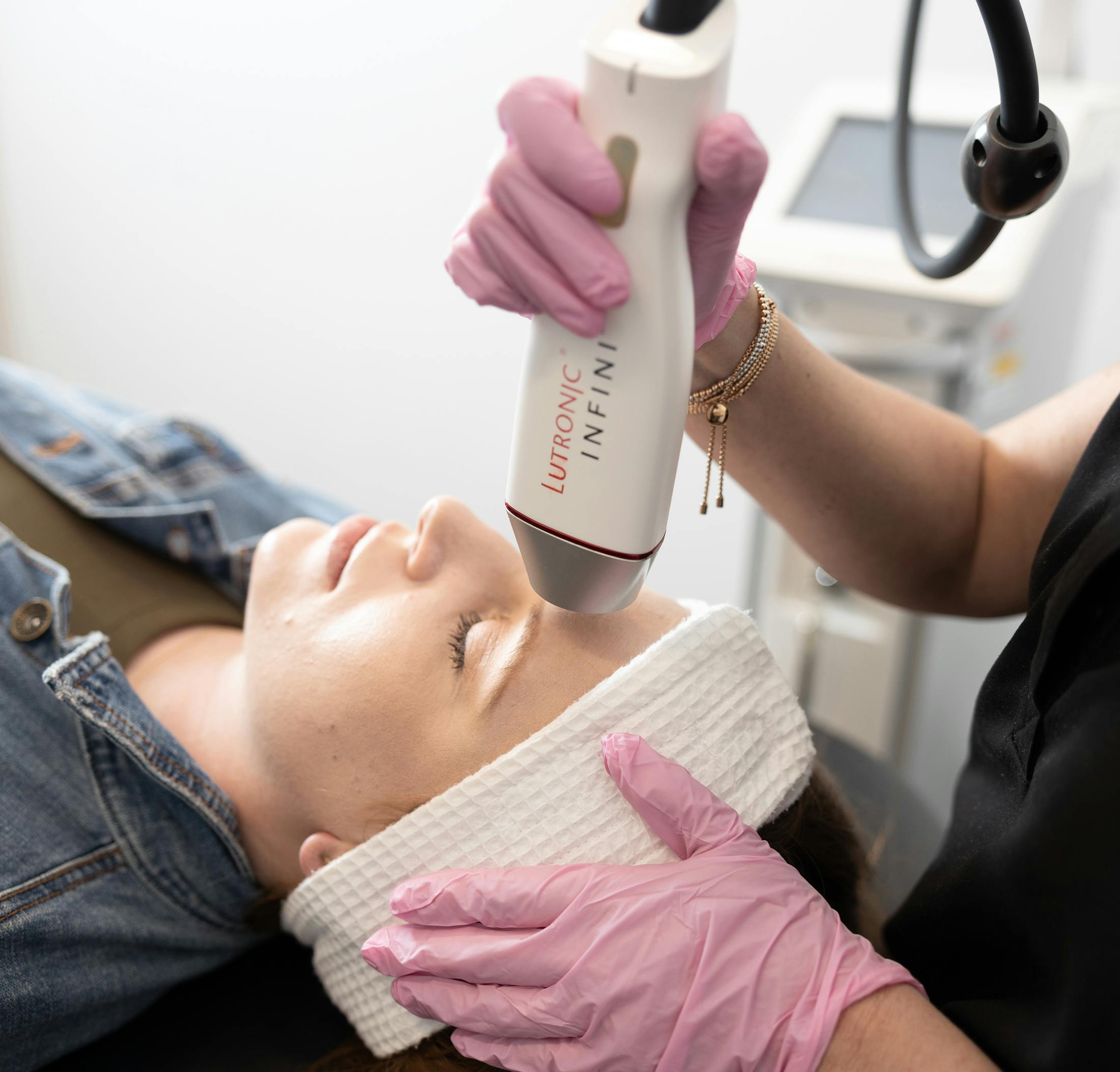 woman during treatment of RF Microneedling in Denver