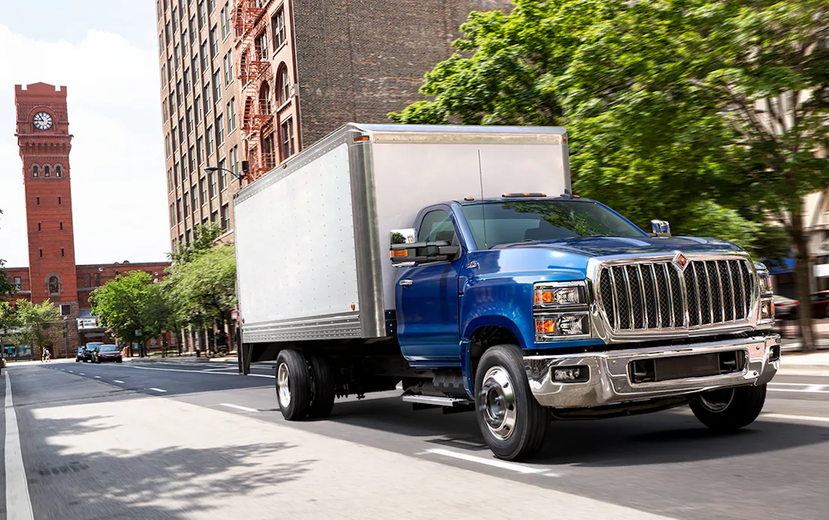 International Truck driving down city street