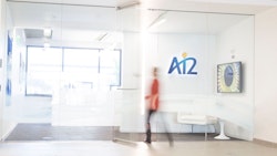 Newsletter Thumbnail for 2019-03. A person enters a glass door to the Ai2 office.