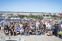 Newsletter Thumbnail for 2019-08. The Ai2 team poses for a photo after our annual Hackathon presentations.