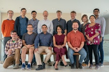 Newsletter Thumbnail for 2019-09. Ai2's Aristo team, standing, left to right: Dirk Groeneveld, Kyle Richardson, Ashish Sabharwal, Peter Clark, Oren Etzioni, Oyvind Tafjord, Carissa Schoenick, Bhavana Dalvi, Tushar Khot.  Seated: Michael Schmitz, Daniel Khashabi, Niket Tandon, Sumithra Bhakthavatsalam, Michal Guerquin .