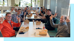 A number of AI2 employees having lunch.