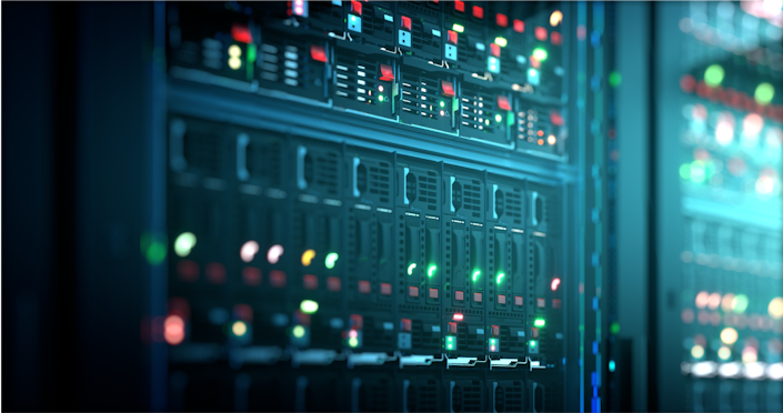 A closeup of a computer server with lots of green and red LED lights.