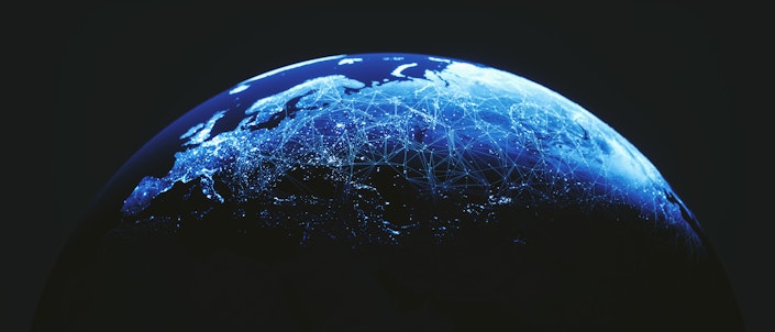 The surface of the Earth covered with blue glowing lines evoking a network.