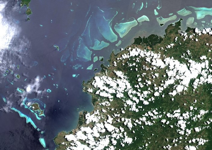 Earth from above, at the intersection of land and ocean.