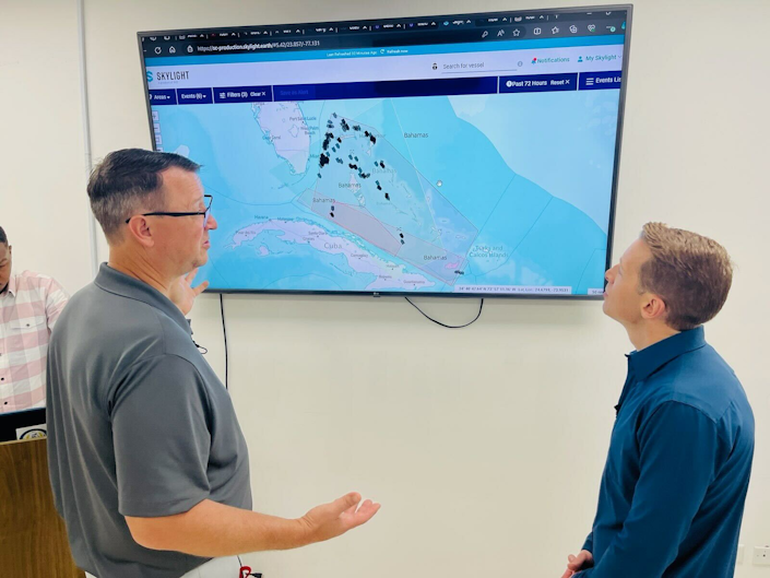 A member of WildAid shows CBS' Ben Tracy the Skylight interface.