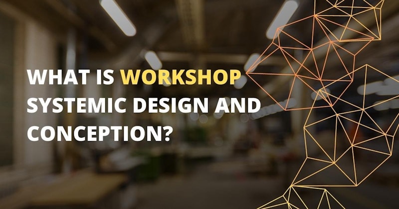 This close-up image shows a workshop, with a logo in the background on the right side. The logo is a white text on a black background, and there is a light on the ceiling as well. There is also a yellow letter on a black background in the lower middle of the image. In the foreground, there is a triangle in focus, and a blurry image of a person's hand just to the left. The room has a window and a sign in the background, and the overall image is slightly out of focus.