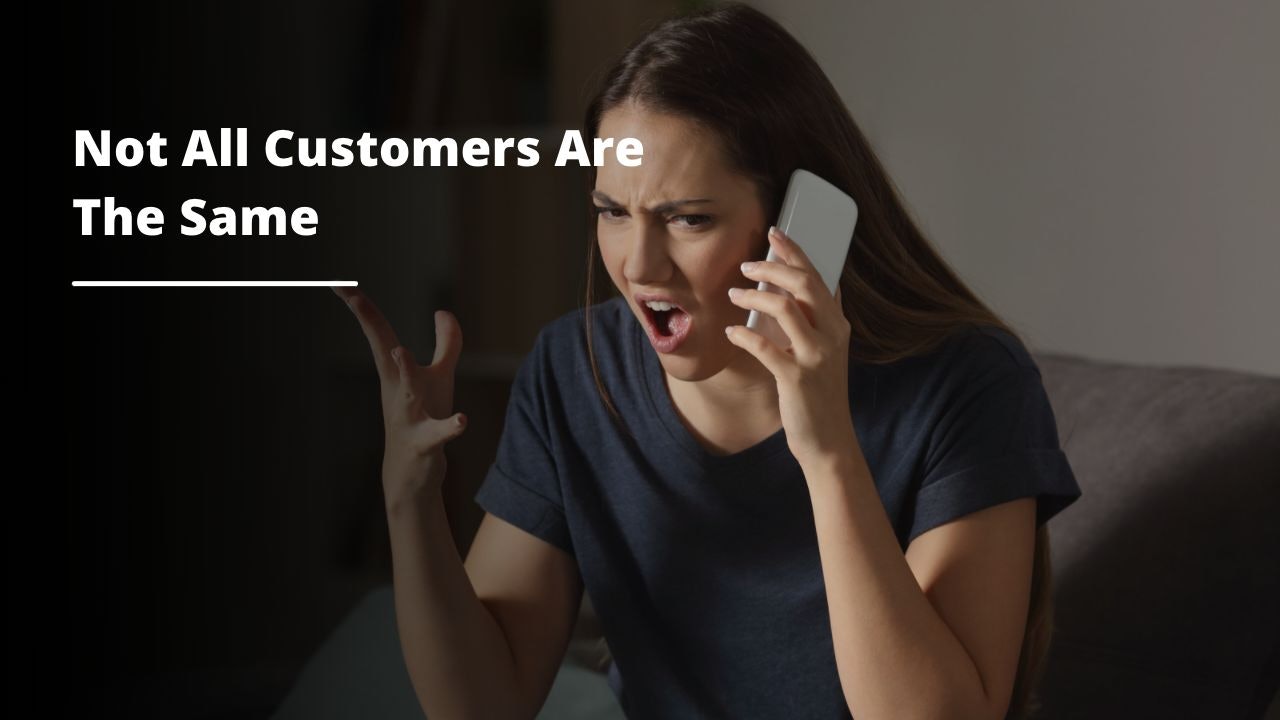 A woman is seen in the image, holding a cell phone up to her face and talking into it. She is wearing a white shirt and a pair of jeans. Her long black hair is pulled back into a ponytail. Her facial expression shows that she is engaged in an intense conversation. Her right hand is holding the phone up to her ear, while her left hand is gesturing as she speaks. The background of the image is blurred and out of focus, making the focus of the image solely on the woman and her phone. The image conveys the sense of urgency and importance of the conversation.