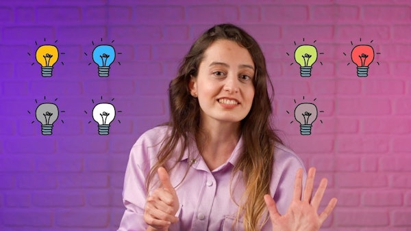 Bir kadın ellerini kaldırmış, yüzünün etrafında ampul desenleri olan açık mavi bir gömlek giymiş halde duruyor. Saçları kısa ve sarıdır ve arkasındaki duvarlar bir ampul çizimi ve pembe ve mor bir arka planla süslenmiştir. Ön planda, sarı bir ampul ve pembe bir arka plan ile elinin yakın çekimi var. Sağda gömleğinin yakın çekimi ve ortada üzerinde bir insan eli çizilmiş bir ampul var. Ampuller yumuşak sarı bir parıltı yayarak çarpıcı ve benzersiz bir atmosfer yaratıyor.