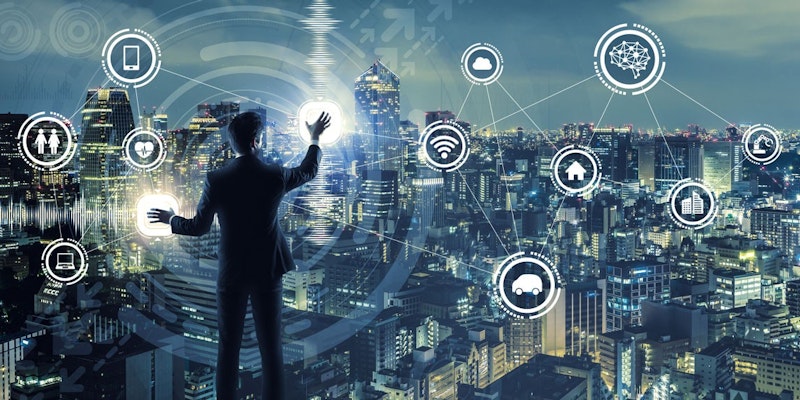 Takım elbise giyen bir adam bir şehir manzarasının önünde durmakta ve bir eliyle bir ekrana dokunmaktadır. Ekranda, bir araba, bir dizüstü bilgisayar, bir cep telefonu ve bir bulut da dahil olmak üzere çeşitli nesneler içeren birkaç beyaz daire vardır. Ekranın üst kısmında ise bir beyin logosu yer almaktadır. Adamın etrafı yüksek binalar ve çok sayıda faaliyetin olduğu canlı ve hareketli bir şehirle çevrilidir. Adamın ifadesi sanki ekrandaki nesneleri dikkatle inceliyormuş gibi odaklanmış ve dikkatlidir.