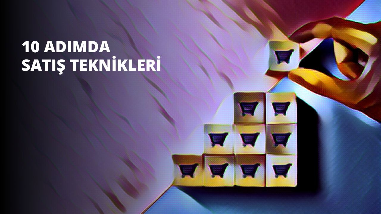 Resimde, üzerinde bir alışveriş arabası bulunan bir grup kutu görülüyor. El arabası kutuların ortasına yerleştirilmiş ve dört tekerleği var. El arabası, bazıları açık kahverengi, bazıları ise koyu kahverengi olan farklı kutularla doludur. Açık kahverengi kutular sol tarafta, koyu kahverengi kutular ise sağ taraftadır. Arka plan bulanık, ancak grimsi bir renk gibi görünüyor. Alışveriş arabası siyahtır ve üst kısmında bir tutma yeri vardır. Arabanın altında küçük siyah bir etiket var.