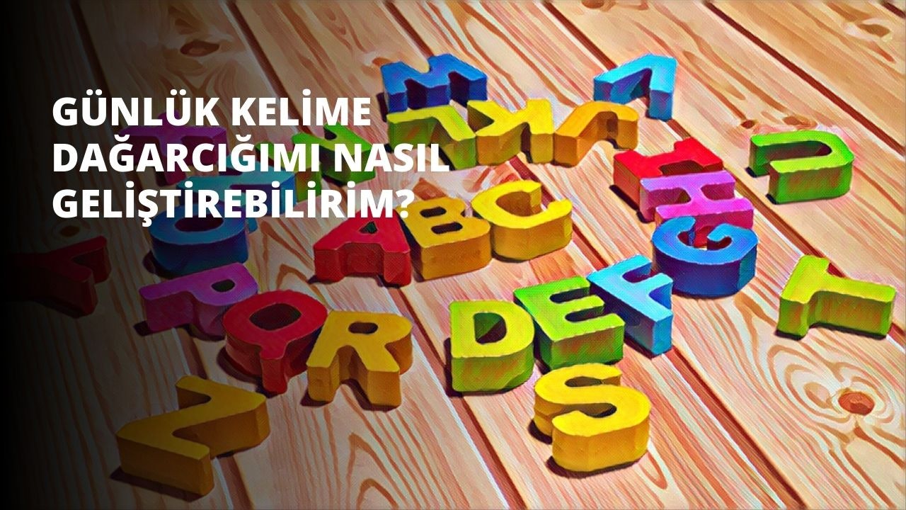 Ahşap bir masanın üzerine renkli bir dizi harf yerleştirilmiştir. Harfler kırmızı, sarı ve pembe gibi çeşitli renklerde. En çok sarı D harfi göze çarparken, delikli pembe bir nesne en dikkat çekici olanıdır. Sol tarafta siyah saplı kırmızı bir nesne, sağ tarafta ise sarı ve yeşil bir nesne yer alıyor. Ek olarak, siyah delikli sarı bir blok ve üzerinde rakam olan sarı bir nesne bulunmaktadır. Tüm öğeler estetik açıdan hoş bir şekilde düzenlenmiş ve ilginç bir görüntü oluşturmuştur.