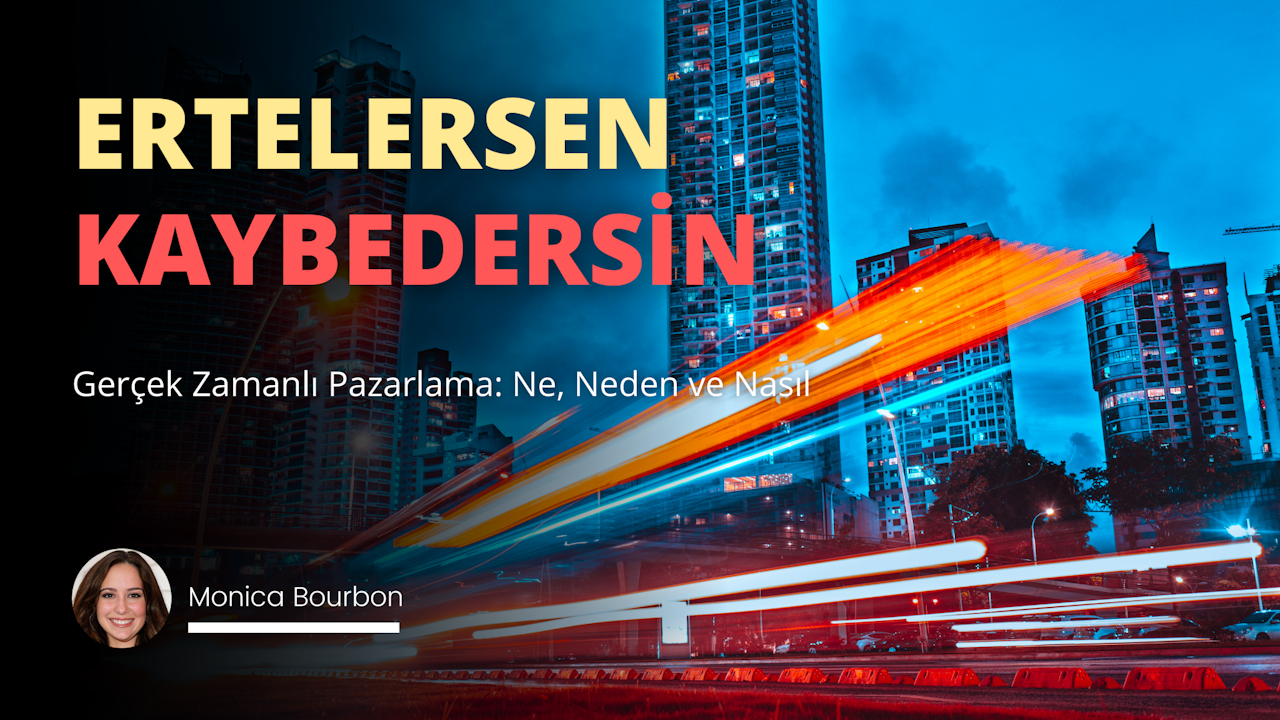 Bu, bir şehrin bulanık bir görüntüsüdür. Görüntü, arka planda çok sayıda yüksek bina ile şehrin siluetini göstermektedir. Binalardan birinin üzerinde sarı bir harf, diğerinin üzerinde ise kırmızı bir B harfi görülüyor. Şehir manzarasında kırmızı ve mavi bir ışık izi de var. Ön planda raylar üzerinde bir tren geçmektedir. Sağda, gülümseyen bir kadının yakın çekim görüntüsü görülüyor. Kadının hoş bir ifadesi var ve beyaz bir gömlek giyiyor. Bu görüntüdeki renkler, görüntünün bulanıklığı nedeniyle çoğunlukla soluktur.