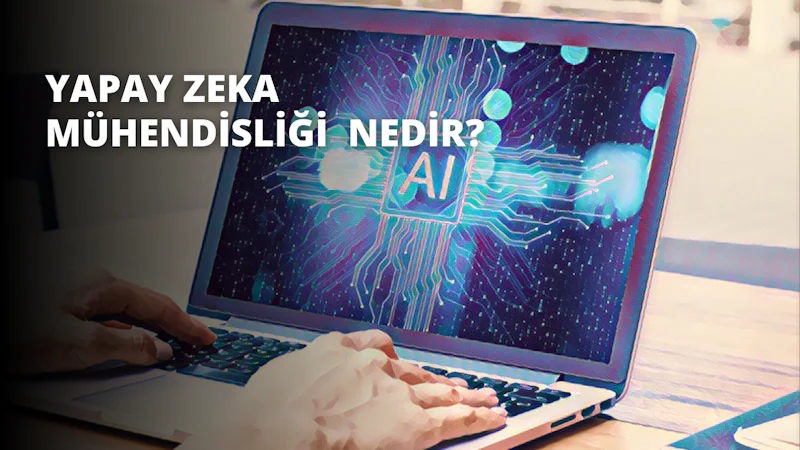 Bir kişi dizüstü bilgisayarının önünde oturmuş, dikkatle bir şeyler yazıyor. Beyaz bir tişört ve koyu mavi bir kot pantolon giymiştir. Sol eli dizüstü bilgisayarın sol tarafında durmakta, sağ eli ise klavyenin üzerinde gezinmektedir. Yüzleri dizüstü bilgisayar ekranına odaklanmış ve gözleri konsantrasyon içinde kısılmış. Saçları kısa ve koyu kahverengi, tenleri ise açık renk. Dizüstü bilgisayar siyah ve gümüş renginde, klavyenin tuşları yeni ve parlak görünüyor. Masa açık ahşap renginde ve köşede küçük bir bitki var. Oda iyi aydınlatılmış ve sağ tarafta bir pencere var.