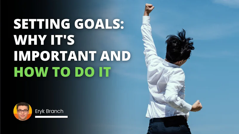 A man wearing a white shirt is standing with his arm raised, his black hair blowing in the wind. He is wearing glasses and has a determined expression. In the background, there is a black textured background with white text at the top, a blue background with a single white letter in the center and two black backgrounds with green letters at the bottom. The first letter is a D and the second is an O. The man looks determined and confident in his stance.