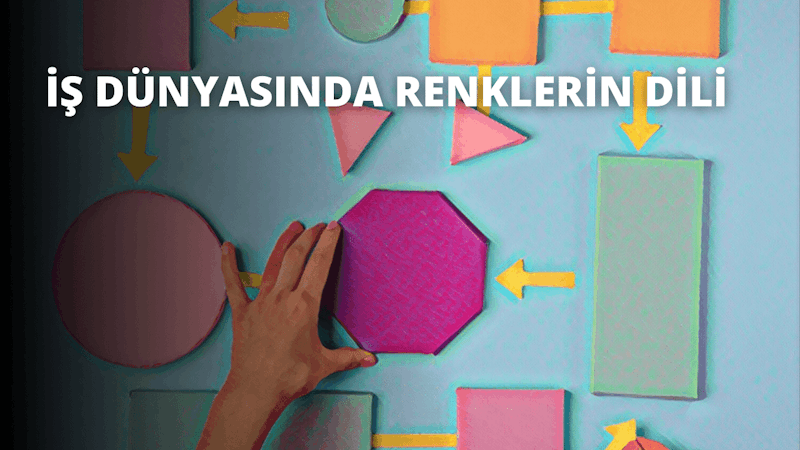 Bir el, üzerinde çeşitli renkli şekiller ve desenler bulunan bir duvara dokunmaktadır. Ortada büyük pembe bir altıgen ve solunda daha küçük bir daire var. El altıgeni yerinde tutuyor ve parlak arka plana karşı vurgulanıyor. Ayrıca mavi ve sarı bir duvarın yanında sağa işaret eden sarı bir ok var. Görüntünün alt kısmında mavi ve pembe bir arka planla birlikte arka planda bir cep telefonu ekran görüntüsü görülebiliyor. Genel sahne renkli ve davetkârdır; şekil ve renklerin karışımı ilgi çekici bir görsel deneyim yaratmaktadır.