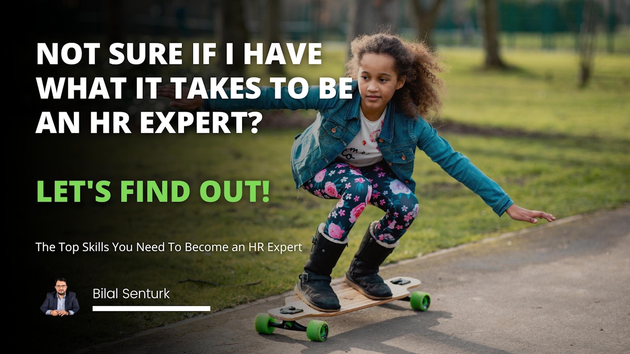 A young girl is riding on a skateboard, wearing a blue shirt and white shorts. She has her arms outstretched, using her balance to stay steady on the board. Her brown hair is pulled back in a ponytail, and her feet are placed firmly on the green wheels. In the background, there is a black wall with a white letter and a green letter on it. The girl is happily enjoying her ride, taking in the world around her as she moves. She is filled with joy as she skates along, feeling the wind whipping through her hair.