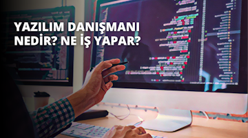 Ekose gömlek giymiş bir kişi bilgisayar başında oturuyor. Kişinin eli bilgisayar faresinin üzerindedir ve yüzü hafifçe bulanıklaştırılarak odak dışı bırakılmıştır. Önündeki masada bir kahve fincanı durmaktadır ve içindekiler de hafifçe odak dışıdır. Kişi dikkatle işine konsantre olmuş gibi görünüyor, parmakları klavyenin üzerinde duruyor. Görüntünün arka planı karanlık ve bulanık, birkaç belirsiz nesne zar zor görülebiliyor.