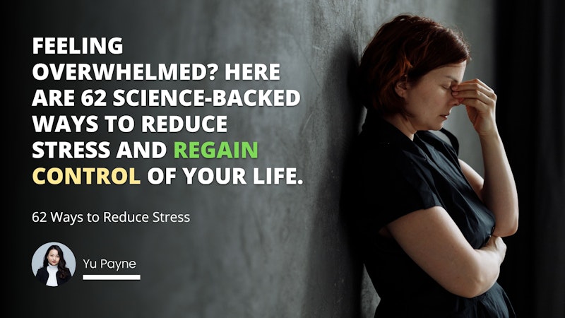 A woman with long, dark hair stands against a white wall. She wears a black jacket and a white turtleneck. Her arms are crossed and left hand is up to her face. She looks off into the distance with a thoughtful expression. In the background there is a screenshot of a social media post, a white letter O on a black background, a yellow letter O on a black background, a white letter O on a grey background, and a white letter on a grey background. The woman's pose is relaxed and confident, and her gaze is distant and thoughtful.