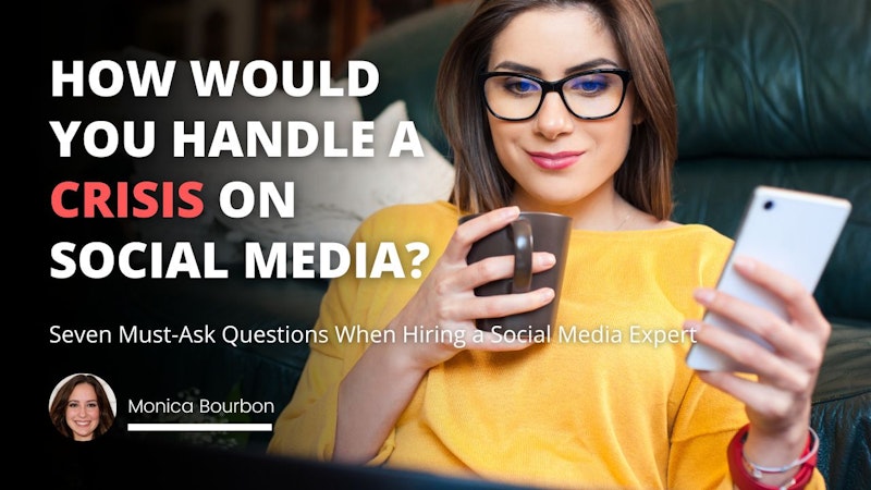 A woman is standing smiling at the camera, wearing glasses and a yellow shirt. She is holding a white cell phone in her right hand and a mug in her left. The mug is a white ceramic coffee cup, decorated with blue and yellow stripes. The woman's face is in close-up, with her eyes and neck visible. Her long brown hair is pulled back and her lips are slightly parted in a relaxed smile. Her expression is inviting and warm. She looks content and confident as she grasps the mug with her strong hands, her gaze directed towards the camera.