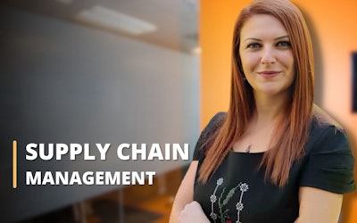 A woman in a black blouse stands at the university in the course center, sliman mansour style, logistics, supply chain and design, photo taken with canon, light gray and red.