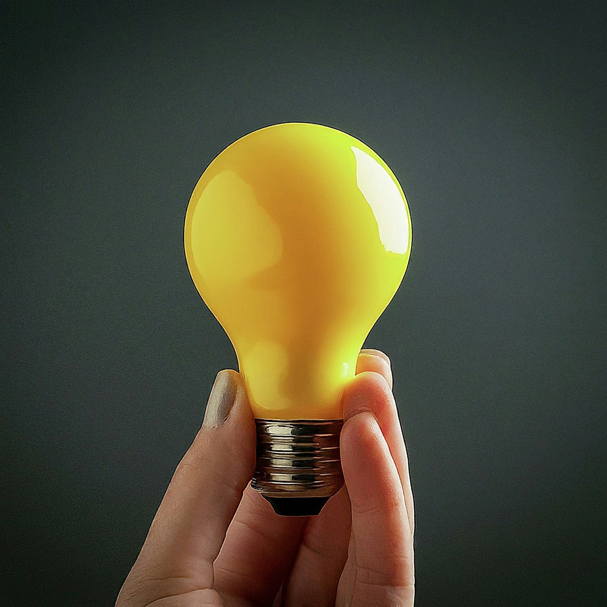 This image is a sequential visual narrative that illustrates the process of conducting an impact analysis, using a palette that emphasizes yellow, black, and white, with additional colors to mark transitions and highlight specific stages. Identification of the Change: The journey begins with a symbol of innovation, such as a glowing light bulb or an unfurled blueprint, set against a backdrop of bright yellow. This marks the genesis of the project or change, capturing the moment of conception and the clarity with which it must be understood. Determining the Impacts: From the initial symbol, a series of arrows or lines branch out in various directions, sprawling across a canvas of white and light gray. This imagery represents the exploration of the change's potential effects, depicting a network of possibilities and the beginning of an intricate analysis process. Assessing the Changes: The narrative progresses to a more solemn tone with the use of black and deeper gray, where symbols like scales, magnifying glasses, or analytical charts come into play. These icons stand for the meticulous assessment of the previously identified impacts, emphasizing the careful consideration and interdisciplinary expertise involved. Formulating Mitigation Strategies: The final segment showcases tools, a protective shield, or the pieces of a puzzle fitting together, highlighted against a background that incorporates calming tones of green or blue. This part of the image signifies the crafting of targeted strategies to mitigate adverse impacts and bolster positive outcomes, marking the conclusion of the impact analysis process. The entire depiction is linked by smooth lines or steps, guiding the viewer through the methodical progression from conception to resolution, encapsulating the essence of impact analysis in a clear, visual format.