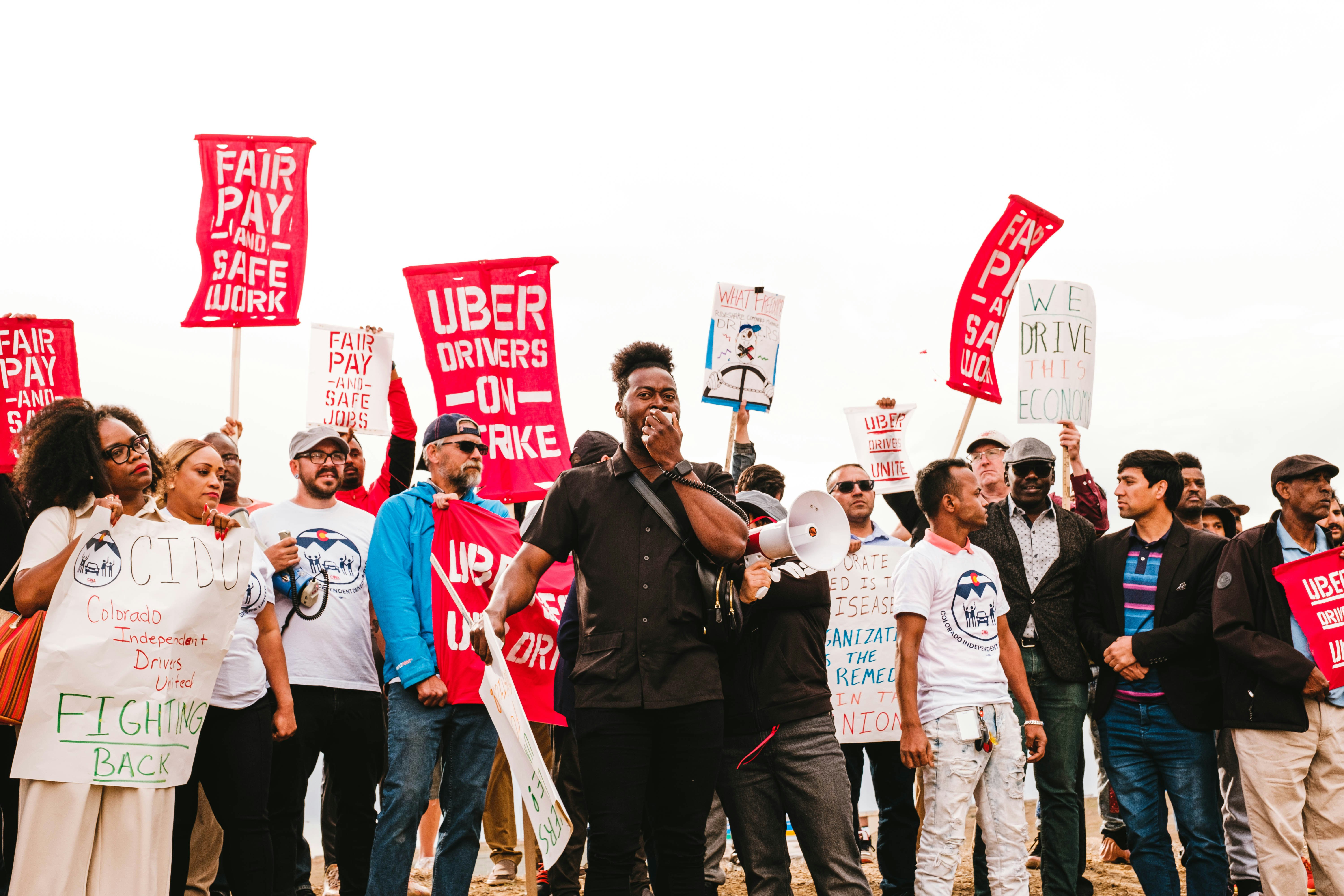 Uber drivers and allies with Colorado Independent Drivers United rallying at Denver International Airport on 5/4/23