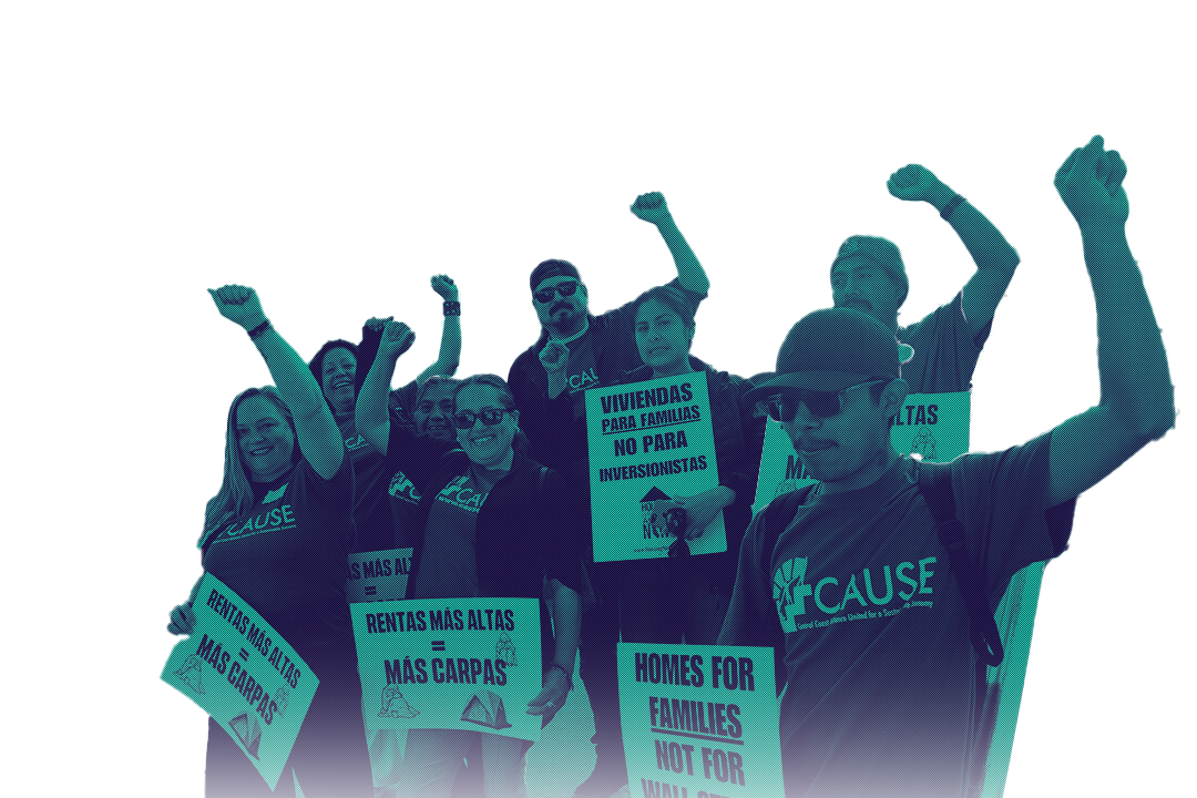 A group of organizers holding signs and raising their fists in front of the Capitol.