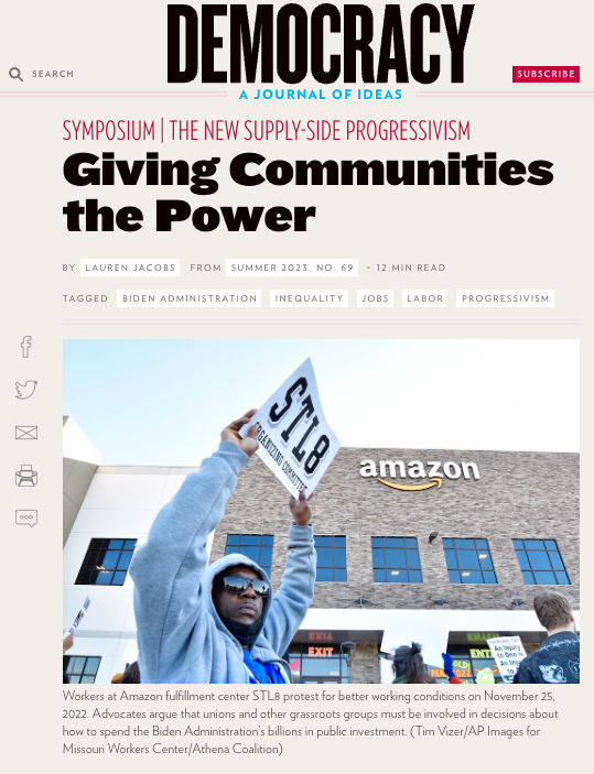 Screenshot of Democracy Journal article titled "Giving Communities the Power, writted by Lauren Jacobs. Includes a photo of an STL8 Amazon worker holding up a sign in front of the warehouse.