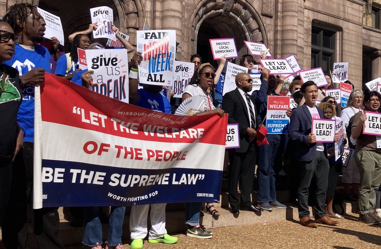 Workers with MWC rally with local elected leaders against preemption