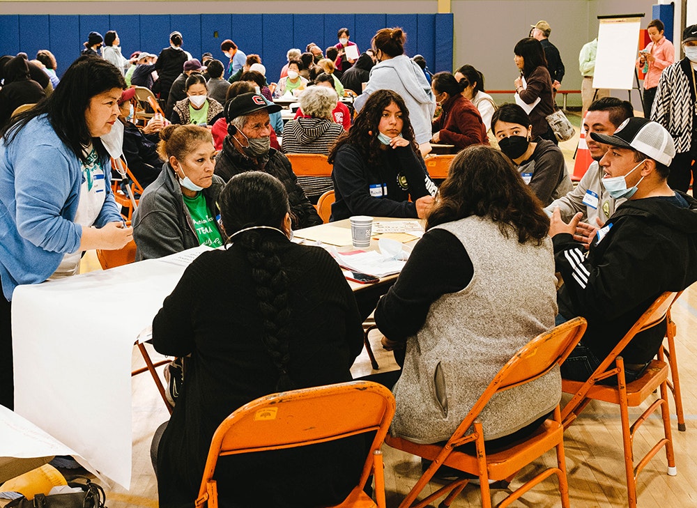 People discuss budgets in Oakland