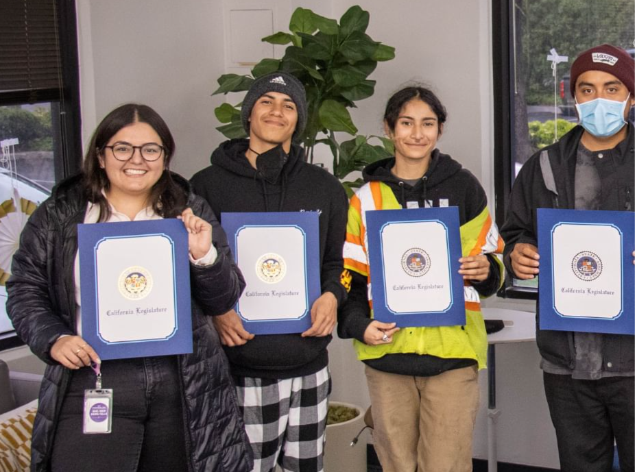 Graduates of WPUSA's 2023 Worker Power Academy smiling and holding their certificates of recognition