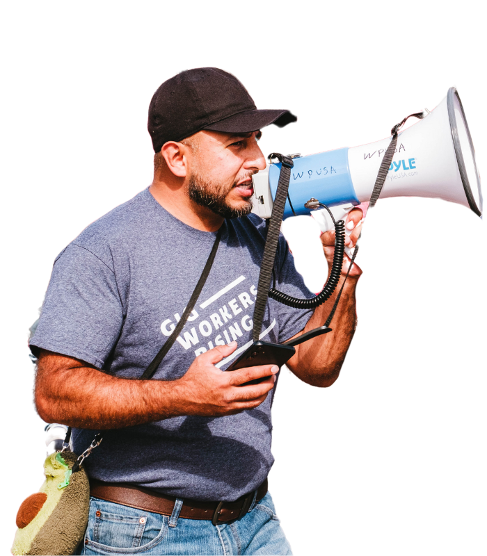 Cesar Palancares with Gig Workers Rising speaks on a megaphone