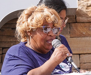 Ms. Willa Shelton speaks at an action outside Greystar's office in Colorado