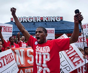 Terrence Wise speaks outside Burger King