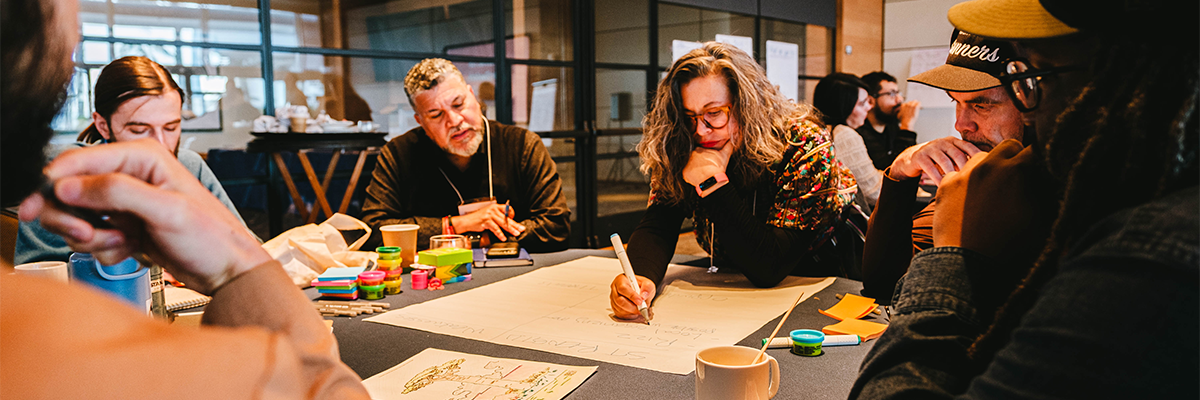 Board members taking notes during the Board Retreat
