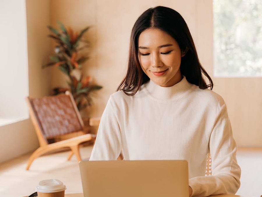 woman sitting at a laptop
