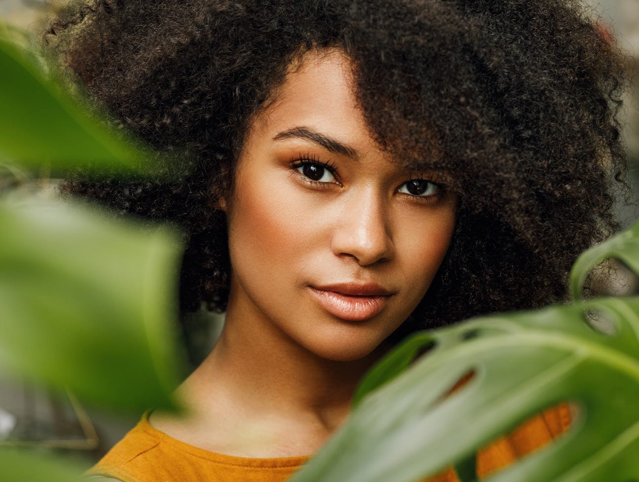 woman behind foliage
