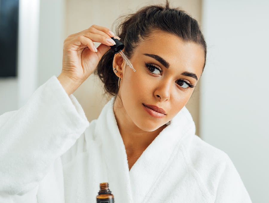 woman applying facial product